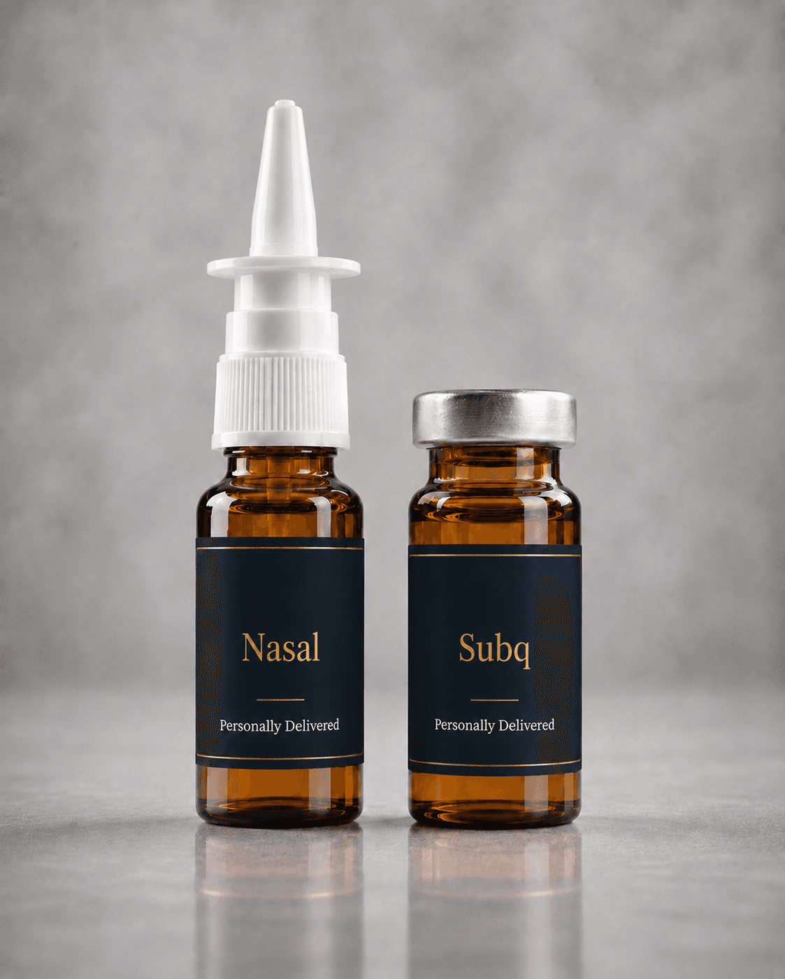 Compounded nasal spray and subcutaneous injectable vials with navy and gold labels on pale stone.